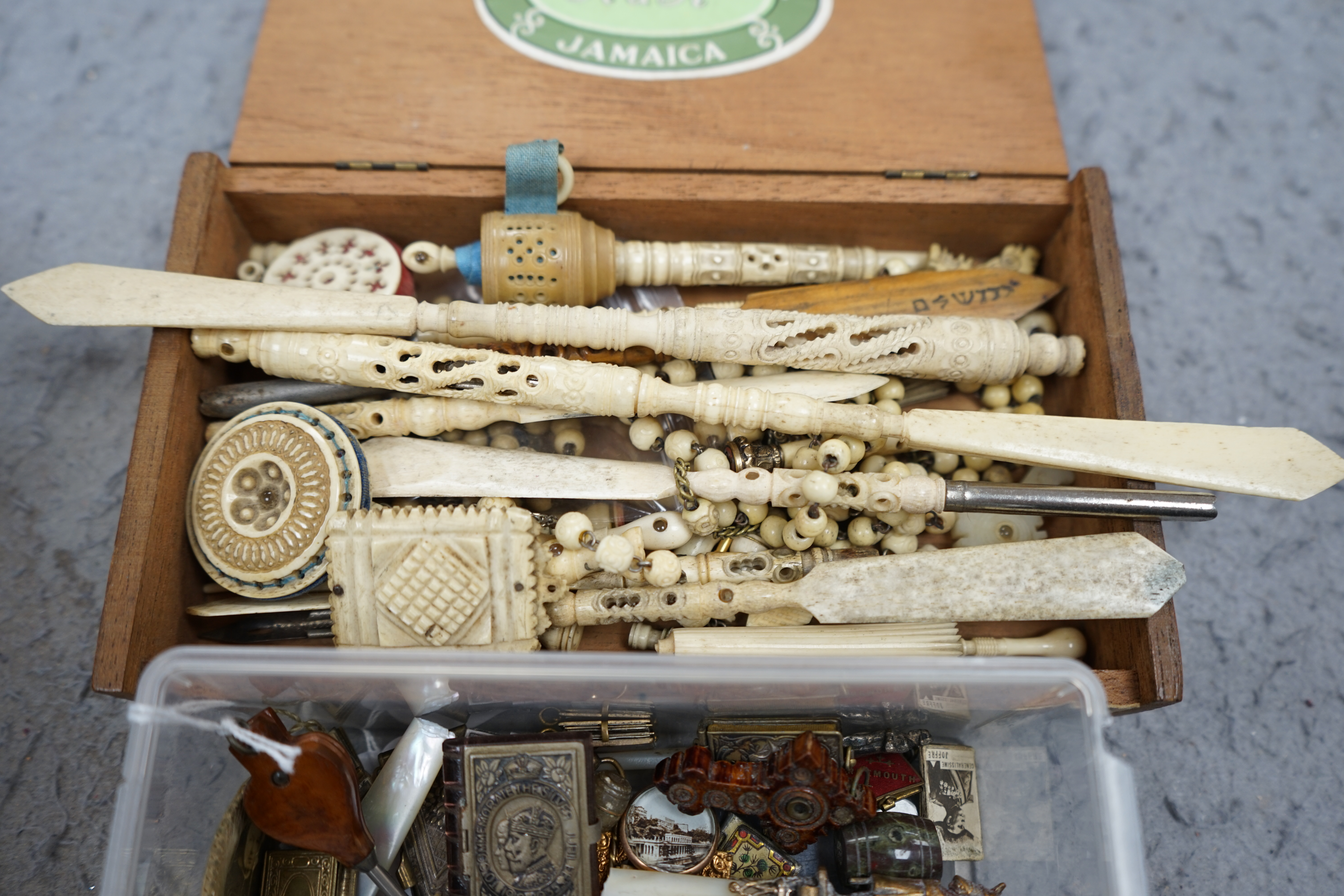 A collection of carved bone Stanhope letter openers, sewing items, miniature book pendants and charms and general novelties, longest Stanhope letter opener 23cm. Condition - poor to fair